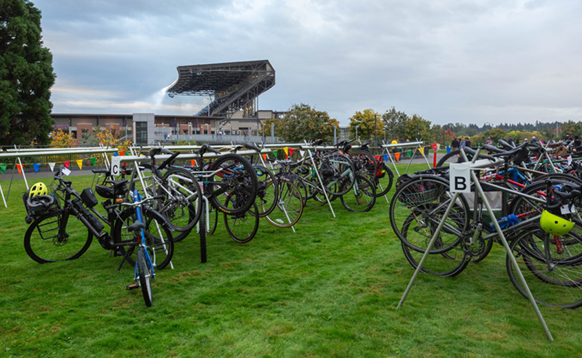 bikes on racks with Husky stadium in background
