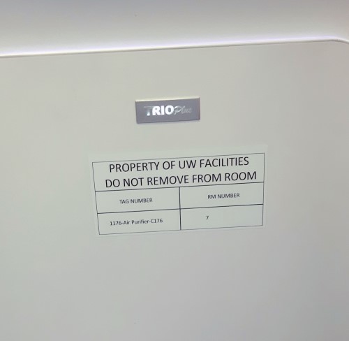 "Property of UW Facilities" sticker on an air purifier