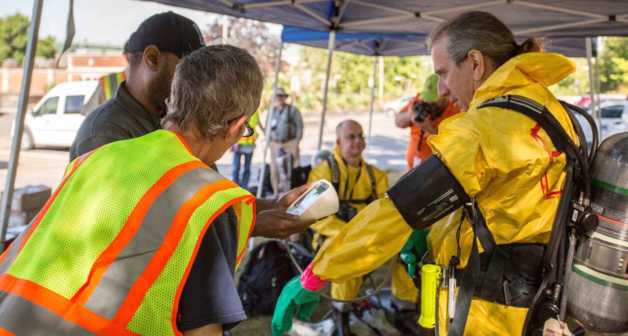 Emergency response teams gear up in hazmat suits for the Cascadia Rising earthquake drill