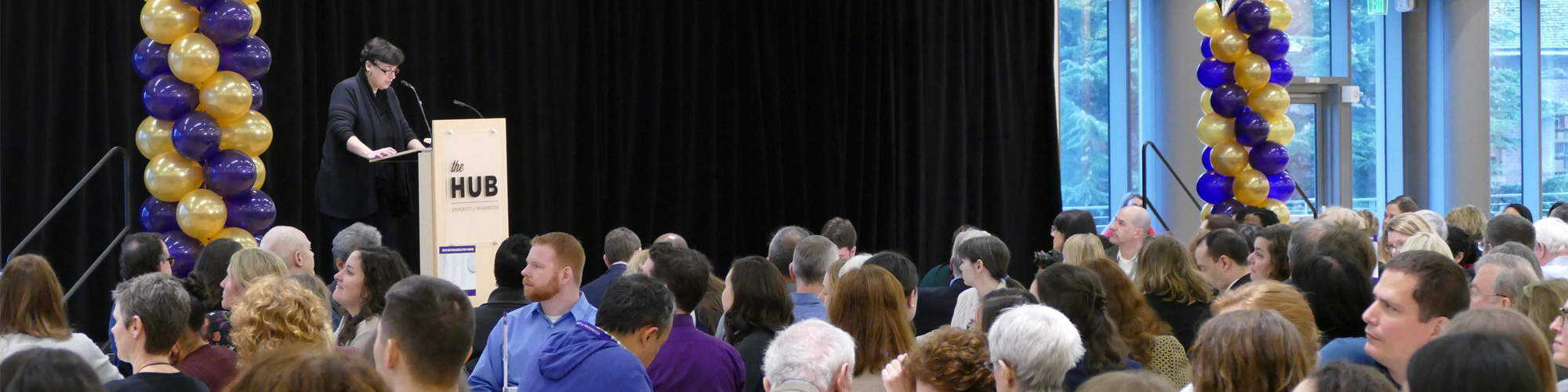 UW President Ana Mari Cauce speaks to guest during Distinguished Staff Awards nomination ceremony.