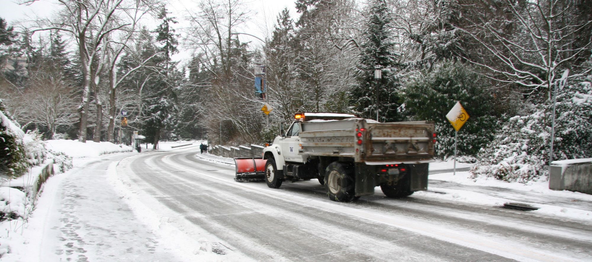 Snow plow truck on snowy Pend Orielle Way