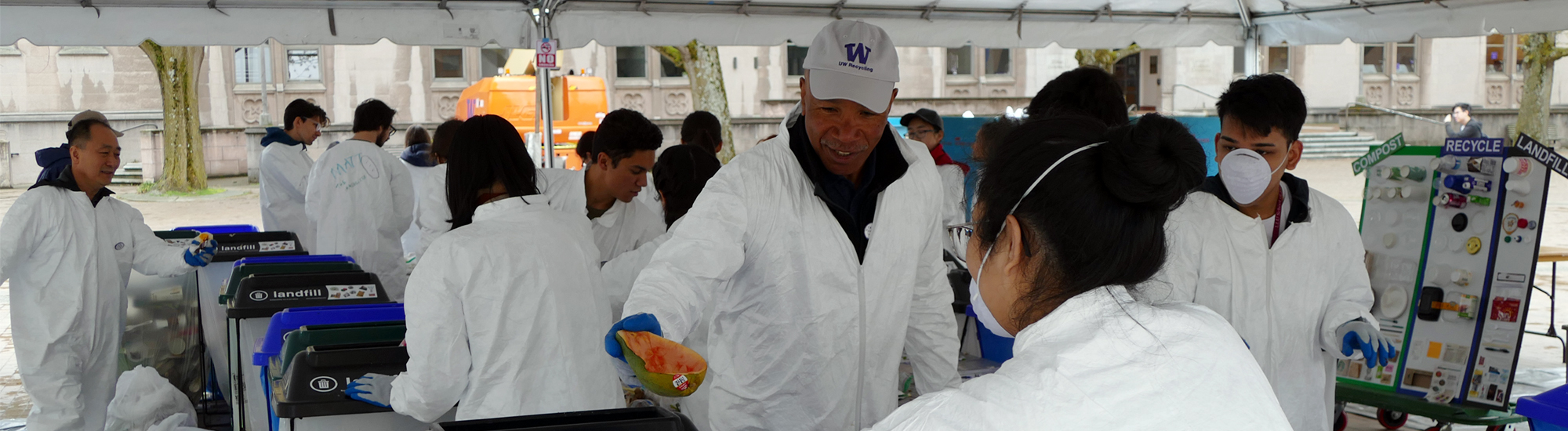 Volunteers work together to sort waste during UW Trash-In event.