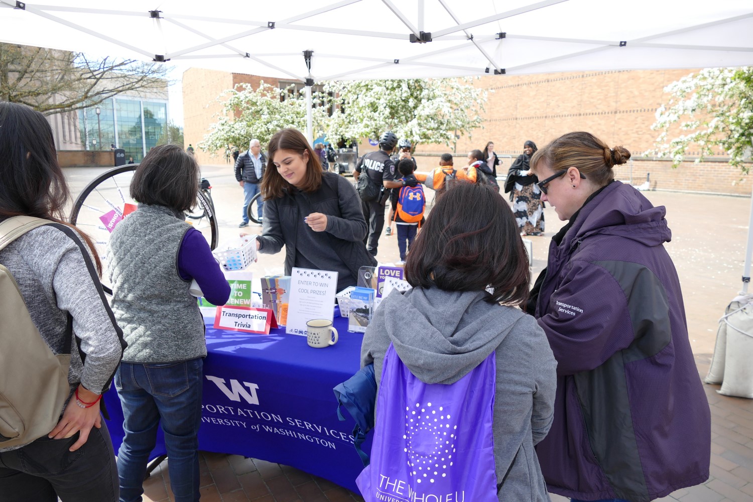 Staff from UW Transportation Services interacts with campus community.