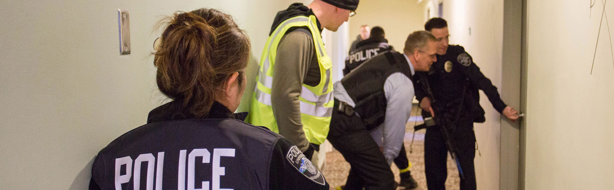 UW Police officers take part in an active shooter training exercise in the now-empty McCarty Hall