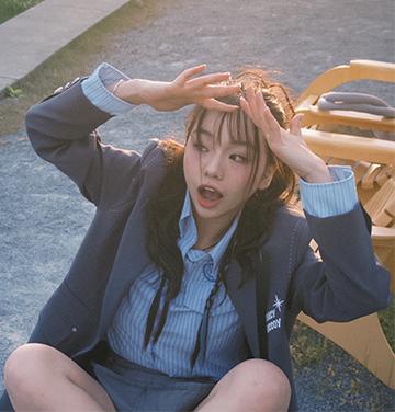 young Asian woman doing a dance move