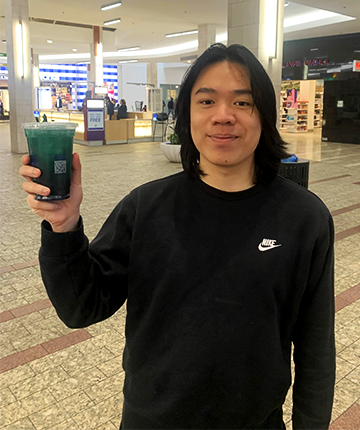 man holding a bubble tea