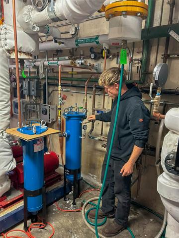 man examines pipes