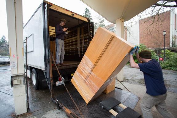 Eric Himes and Phil Aldred load a box truck