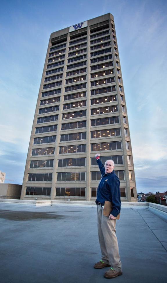 David Record shows off a view of the tower at 6:30 a.m. from the roof of the S building.