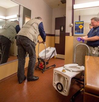 Workers install toilets.