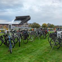 bikes on racks with Husky stadium in background