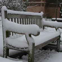 Snow-covered bench in Winter 2021