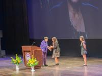 President Cauce shakes Leula Amaha's hand