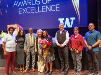 Leula Amaha stands with family and UW Facilities staff