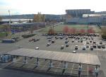 solar canopy in parking lot with Husky Stadium in the background