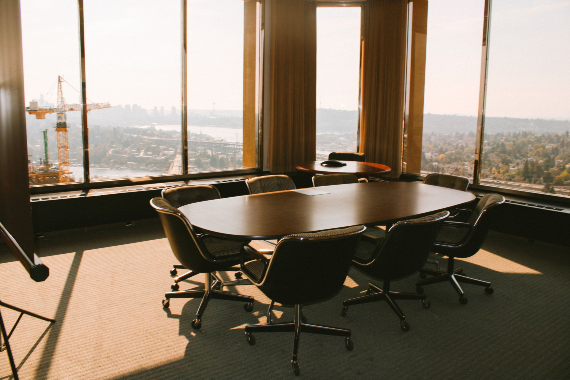 Ballard Conference Room with a view of downtown Seattle and a construction crane on a sunny day