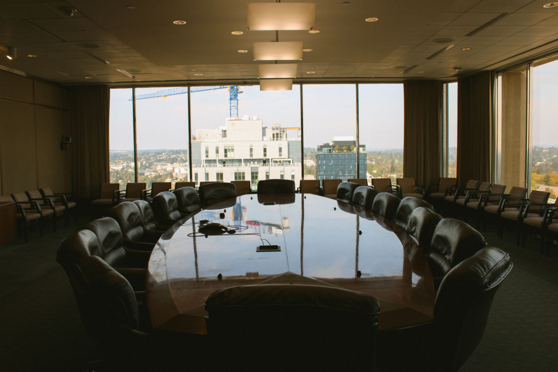 The boardroom with plush chairs and an expansive view