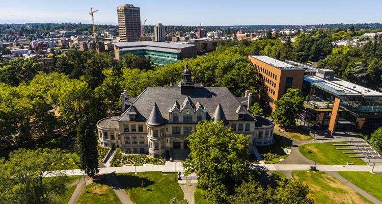 aerial view of denny hall, paccar hall, gates hall and uw tower in background