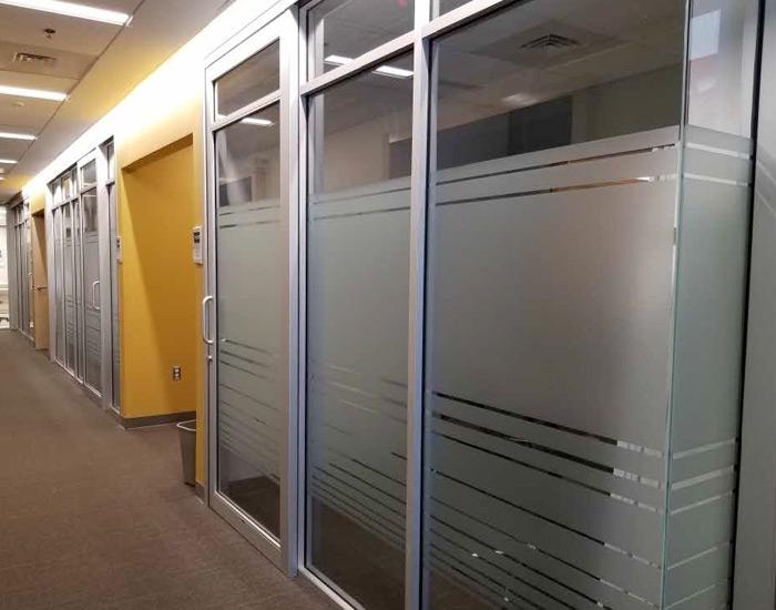 frosted privacy glass application showing office room walls of glass that is frosted