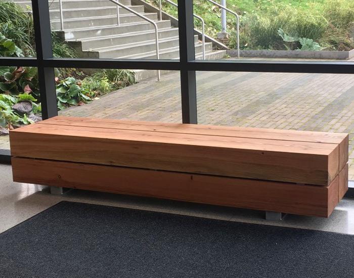 custom wood bench in a building near a window