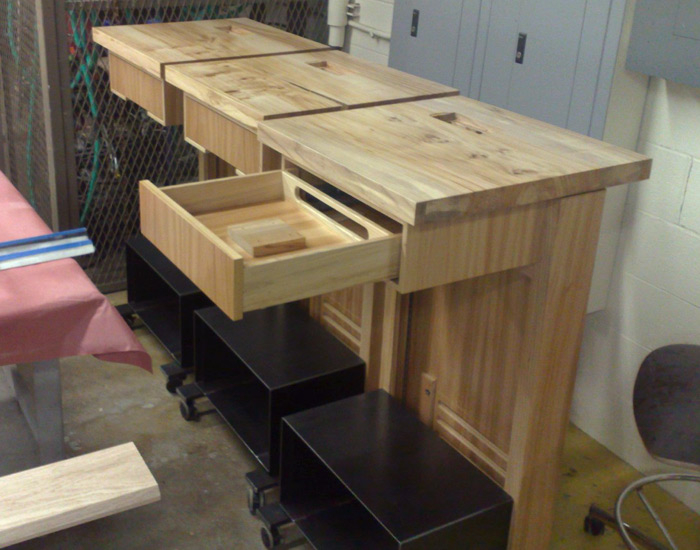 three lecture podiums, one with a drawer open