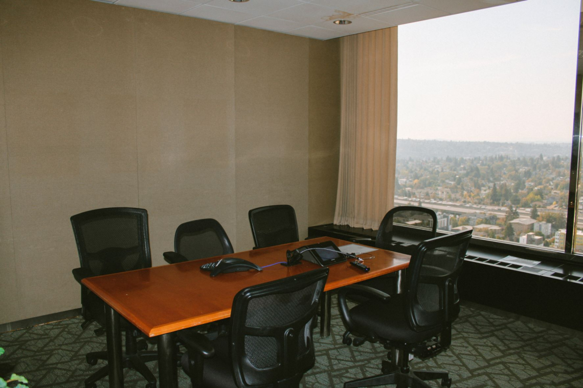 The wallingford conference room is a cozy enclosed room with a window