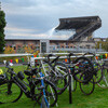 bikes on racks with Husky Stadium in background