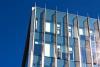 shiny glass building against blue sky