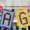 two plastic squares hanging from a string