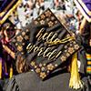 graduation cap with the word 'hello world'