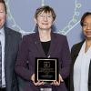 Woman holding award