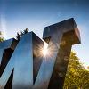 sun shining through W statue on Seattle campus