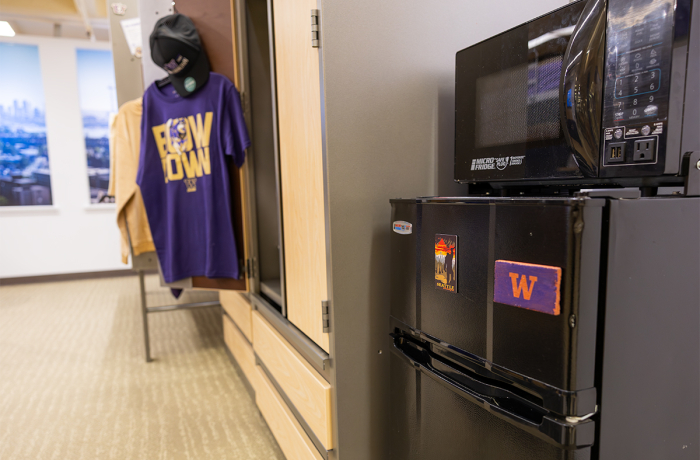 a microwave and minifridge unit in a residence hall