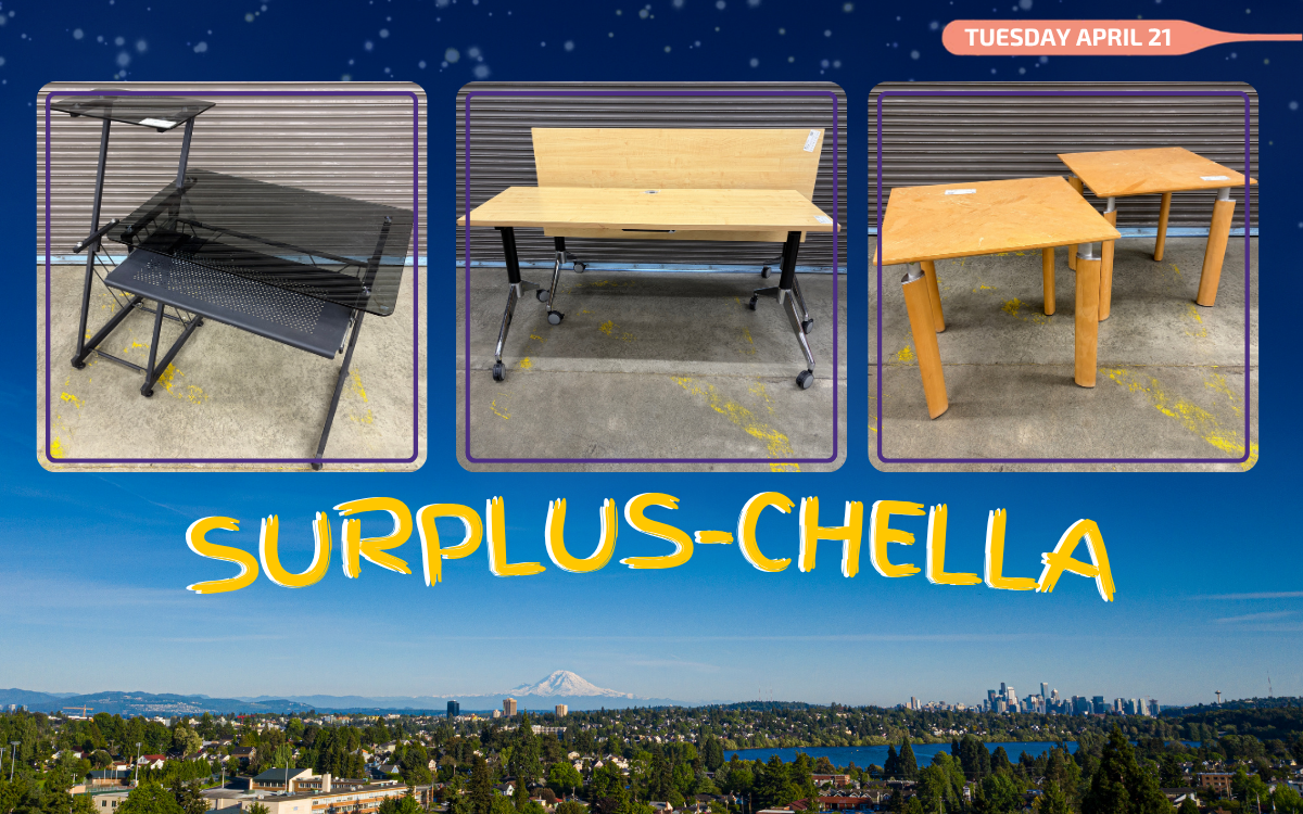 two level glass desk, two flip top tables, two small side table on a picture of the seattle skyline