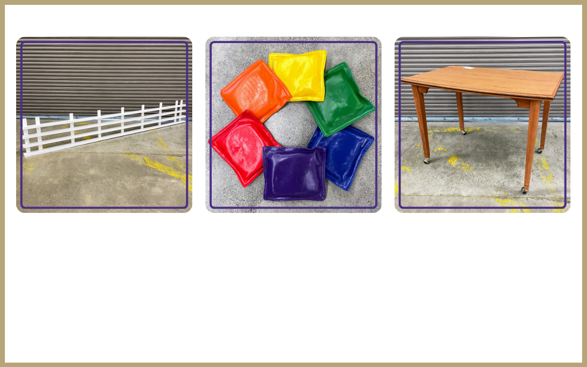 white wood fence panel, rainbow colored bean bags, small wood table on wheels