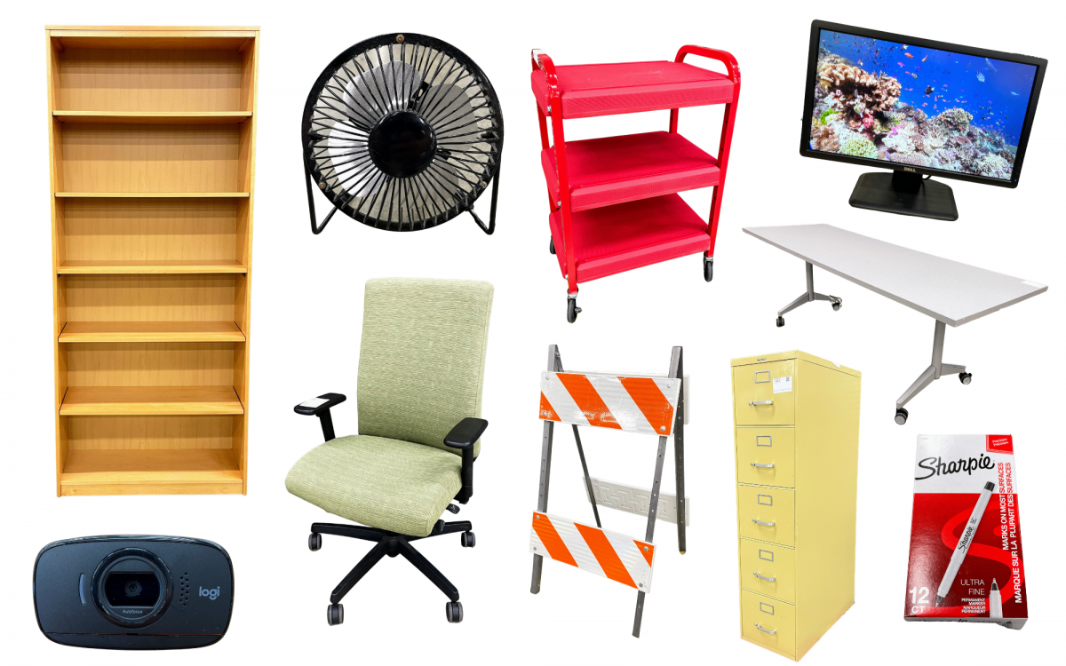 wood bookcase, webcam, fan, green office chair, red 3-tier cart, orange and white barricade, yellow file cabinet, table, computer monitor, box of Sharpies 
