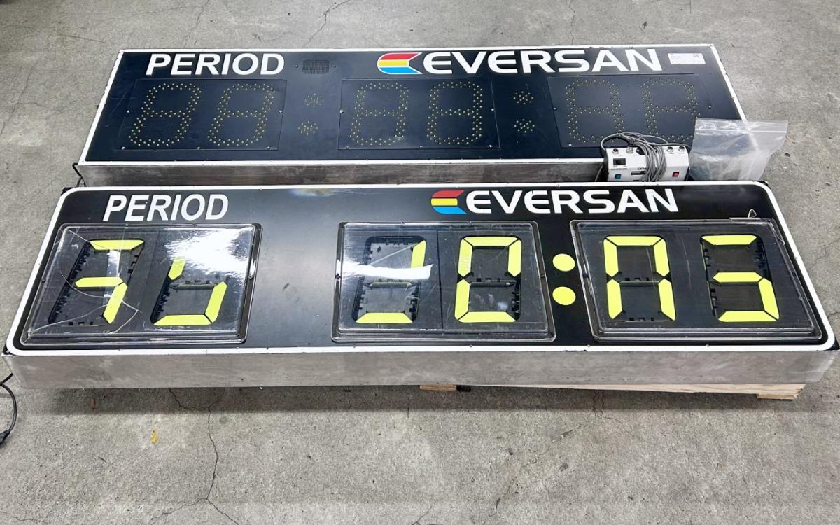 2 sports event score boards on a pallet.