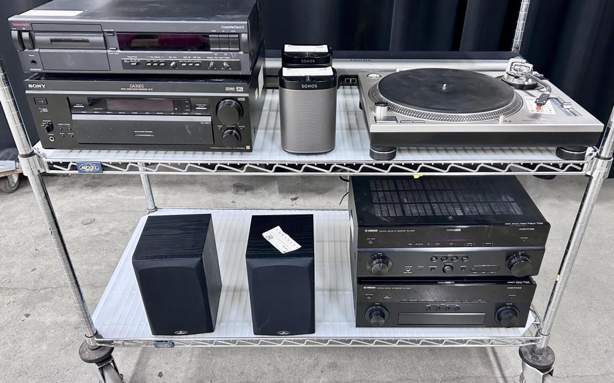 Stereo system components on a cart.