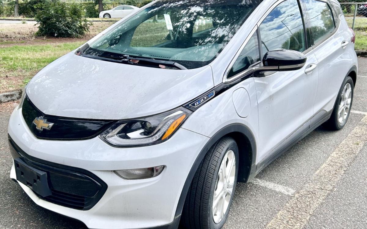 White Chevrolet Bolt electric vehicle.