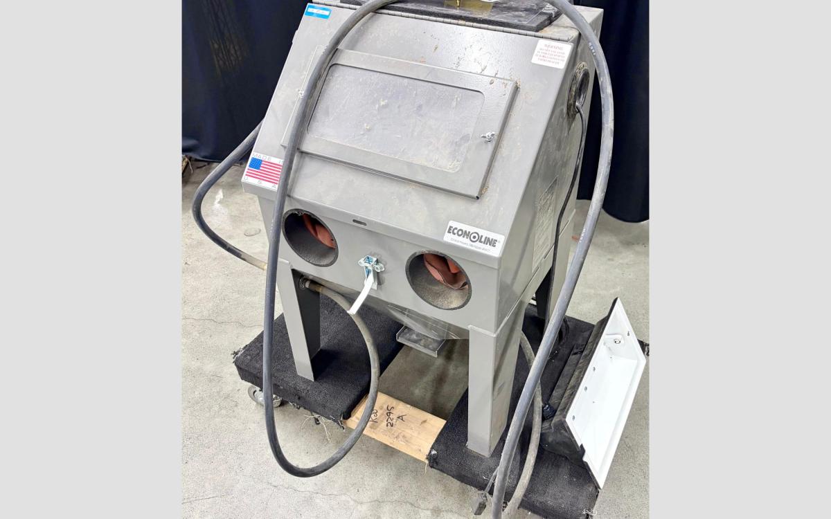 Bench sandblaster unit with Econoline brand visible on it's front.