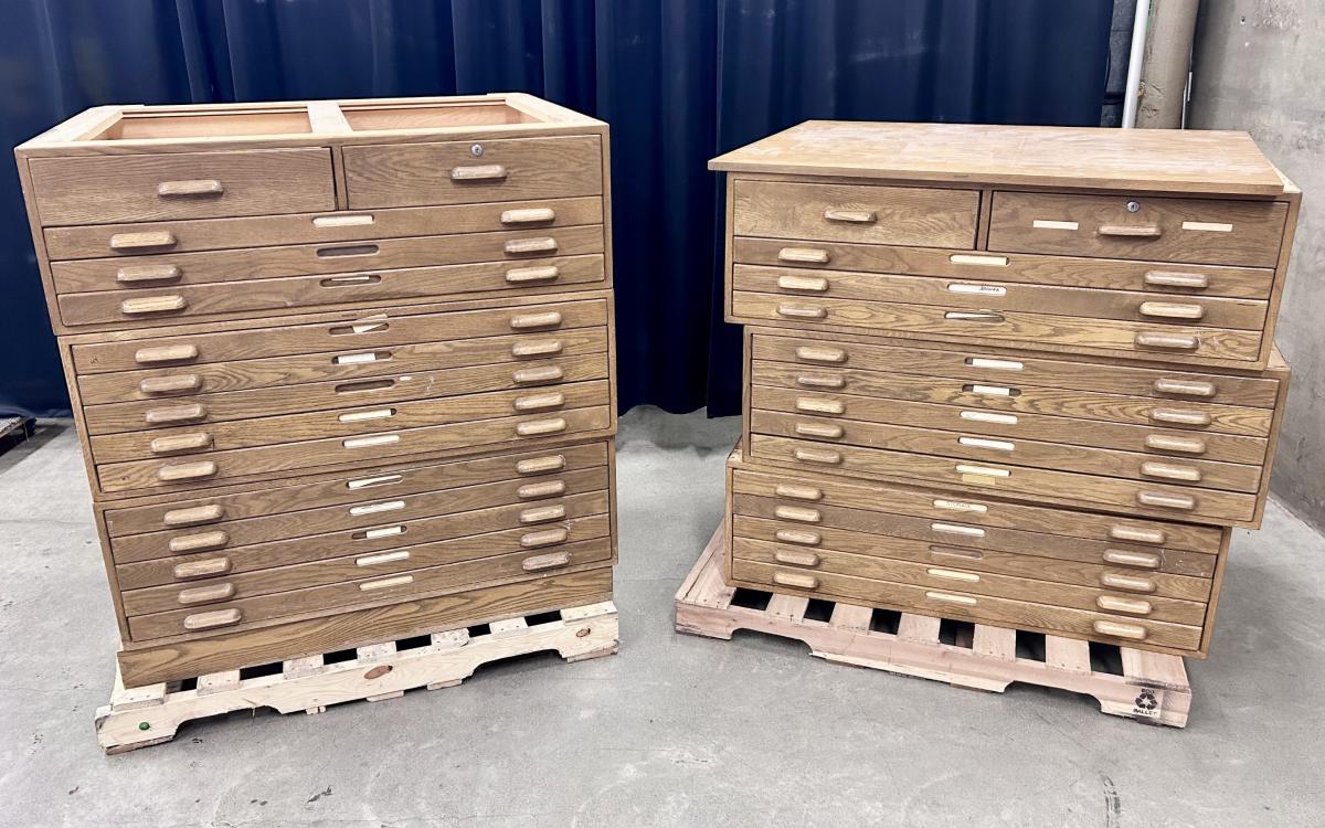 Flat file cabinet sections stacked on two pallets.