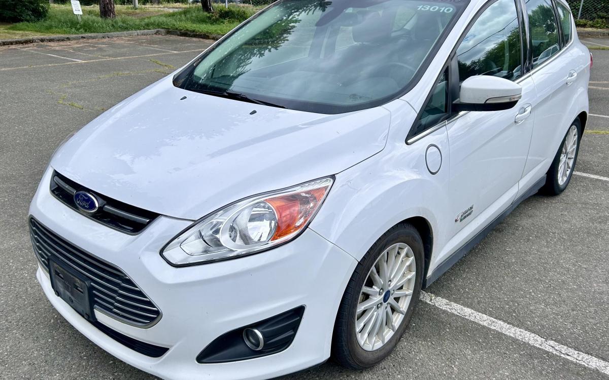 White 2016 Ford CMAX Energi plug-in hybrid car.