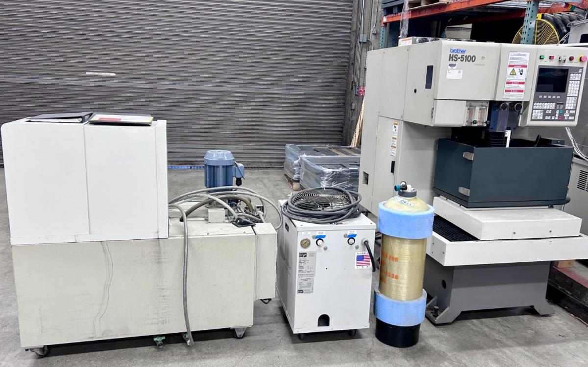 Brother wire EDM with accessories.