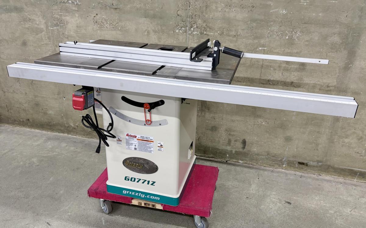 Grizzly table saw on a dolly in a warehouse.