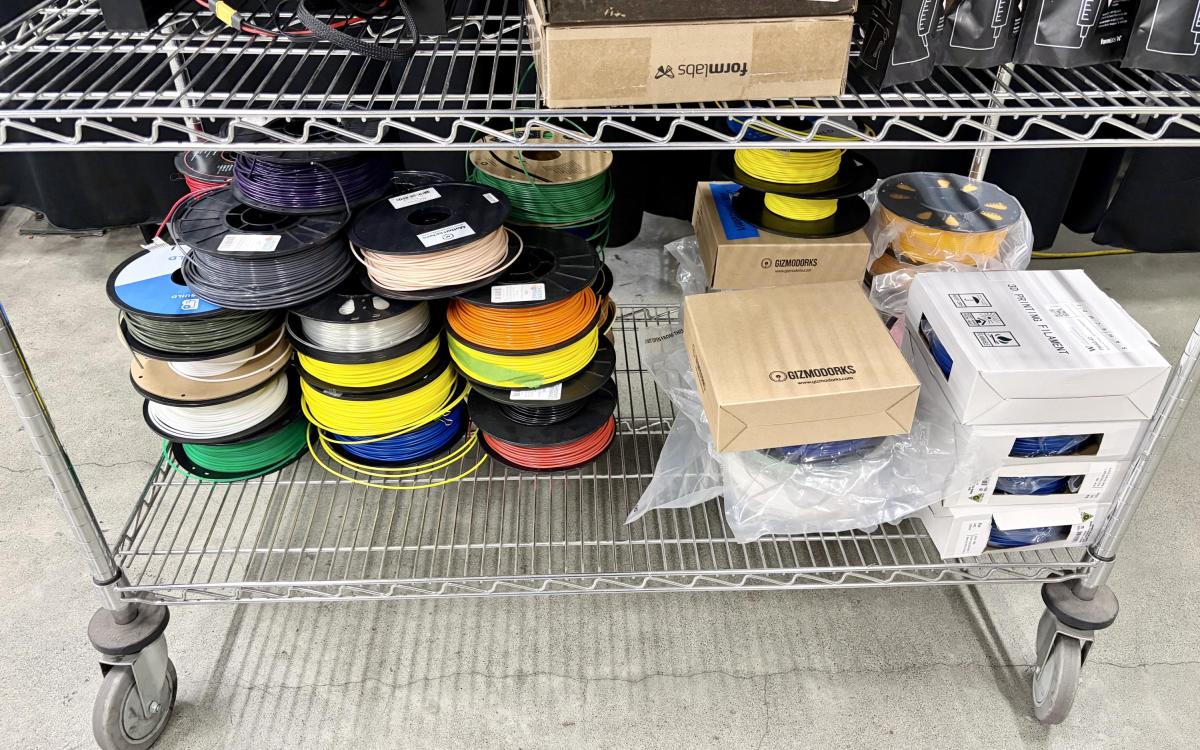 Rolls of 3D printer fillament on a cart.