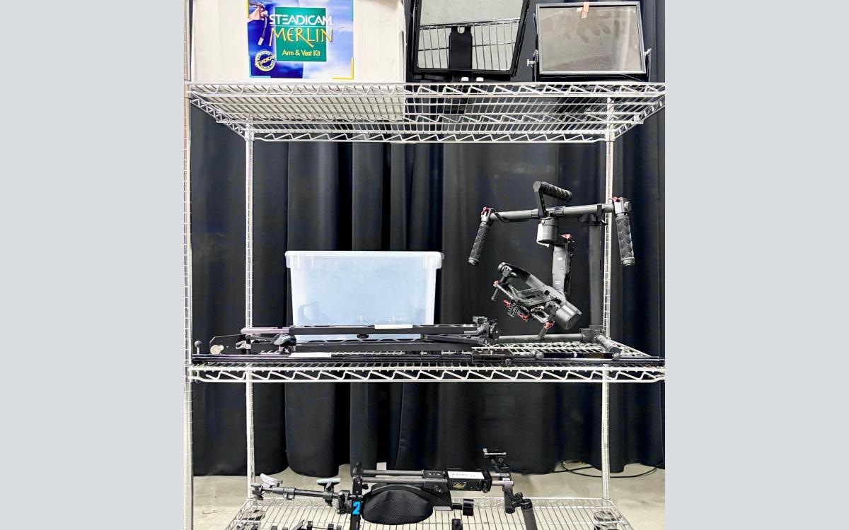 Cart full of steady cams, gliders, teleprompters and other videopgraphy gear.