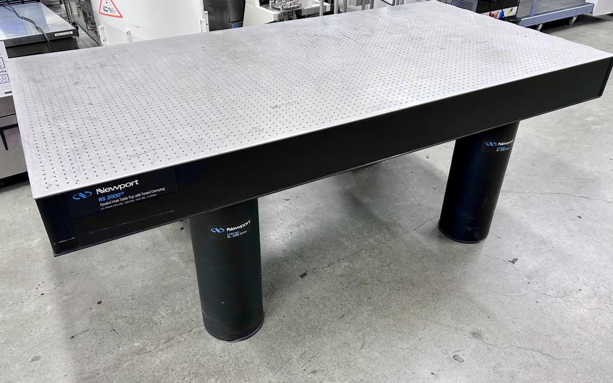 A large silver and black optical table.