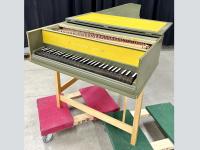 Green and yellow harpsichord.