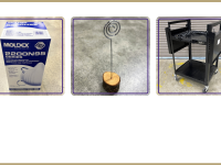 box of N95 masks, photo holder clip with wood base, black AV cart with flip-up sides