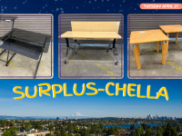 two level glass desk, two flip top tables, two small side table on a picture of the seattle skyline